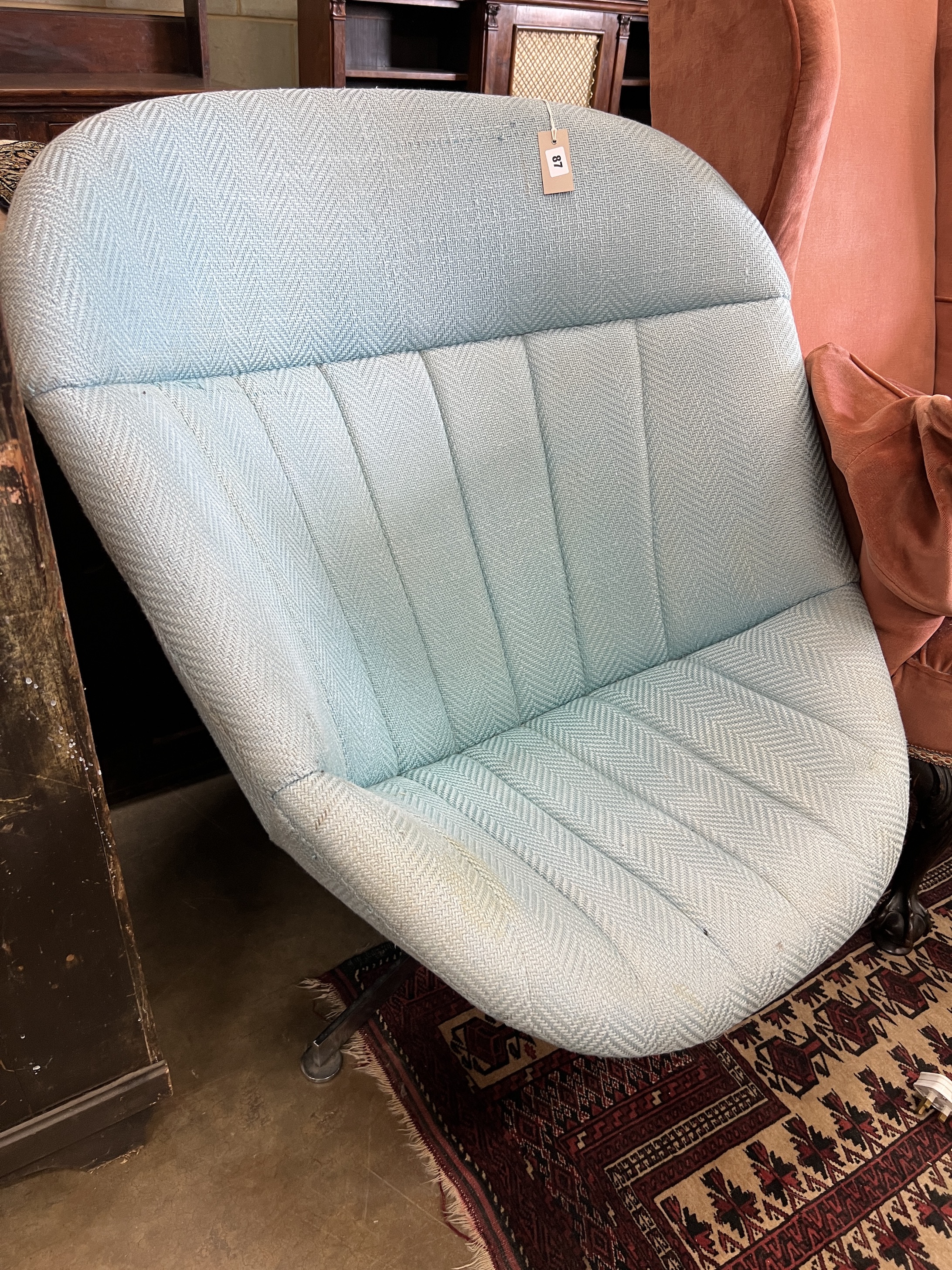 A mid century upholstered egg chair on chrome swivel base, width 86cm, depth 80cm, height 94cm